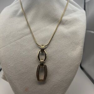 Gold tone geometric necklace